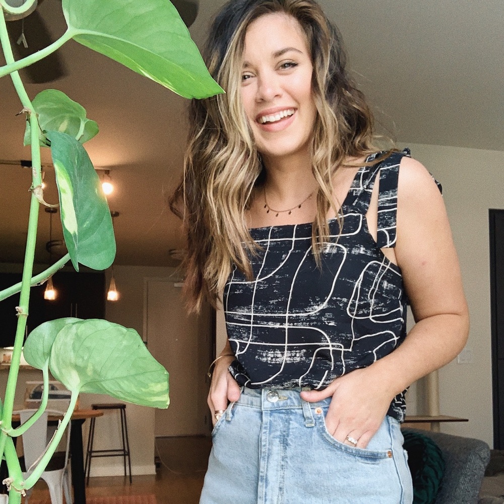 Black and white graphic blouse with ruffled ties!